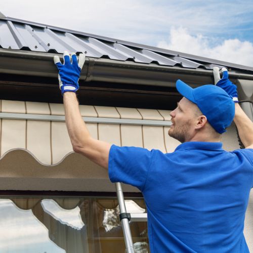 a roofer doing new gutter installation