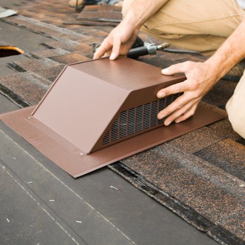 installation of a roof vent in progress
